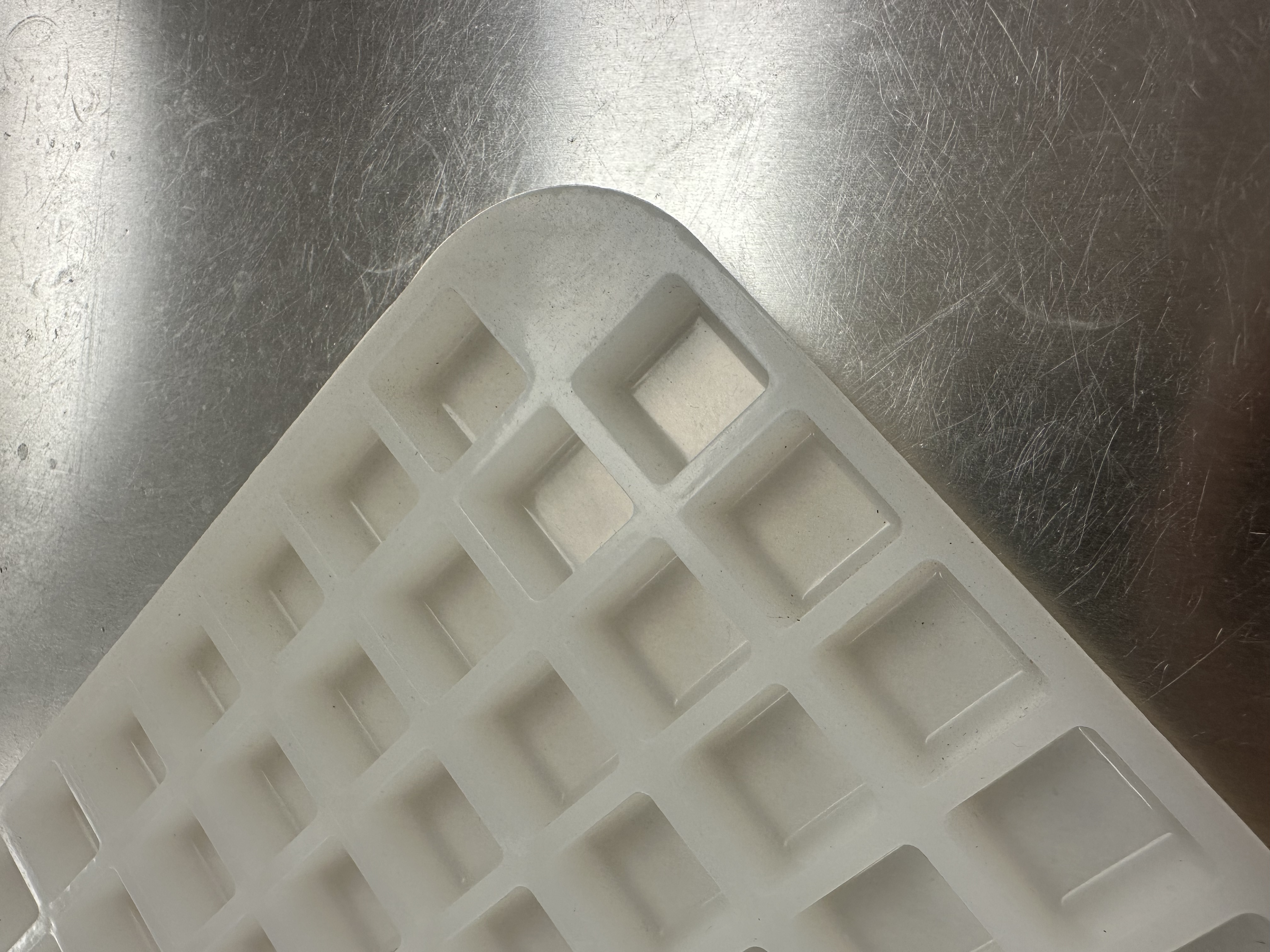 Close-up of square cavities on Product 012