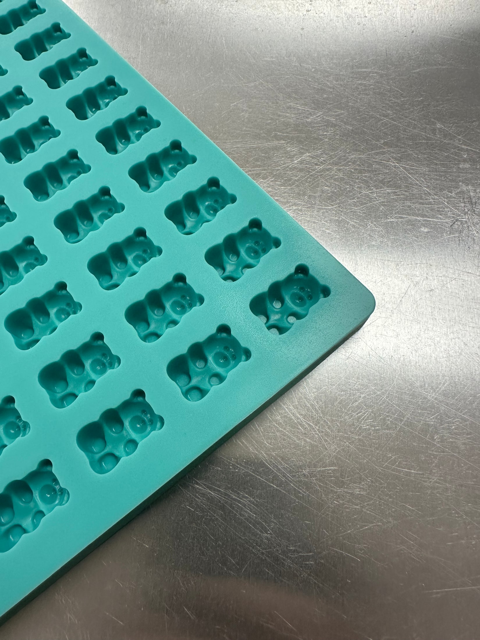 Close-up of medium gummy bear cavities on Product 003